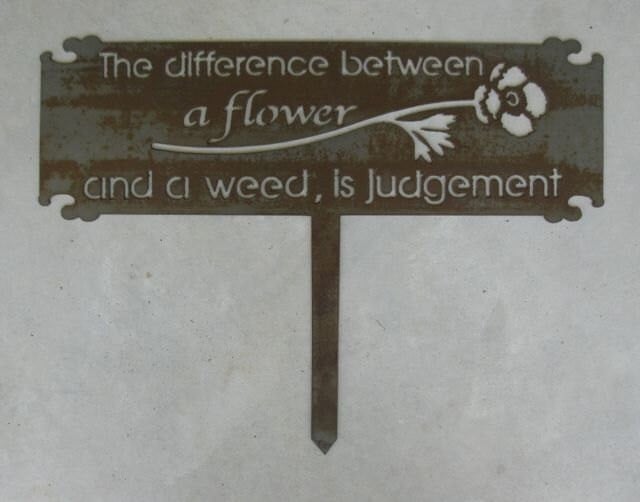 The Difference Between Flowers and Weeds is Judgement metal garden sign